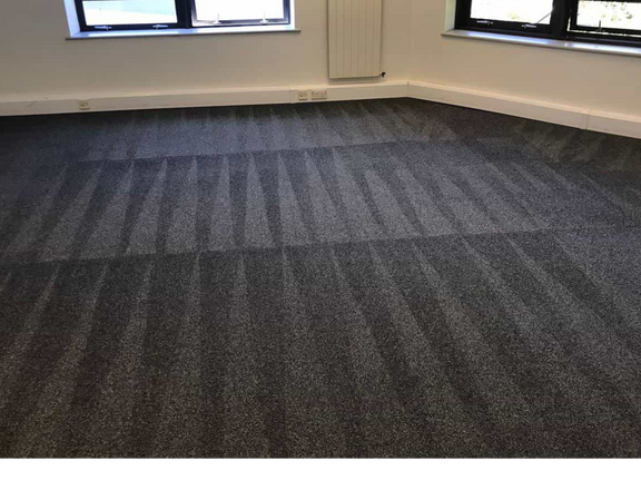 This is a photo of a grey office carpet that has just been professionally steam cleaned.